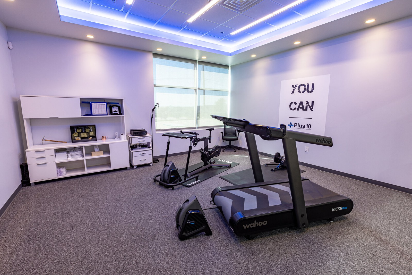 The Plus10 Life performance room in Flower Mound with a Wahoo KICKR RUN treadmill and KICKR bike setup
